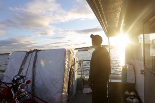 Person watching the sunset on a boat