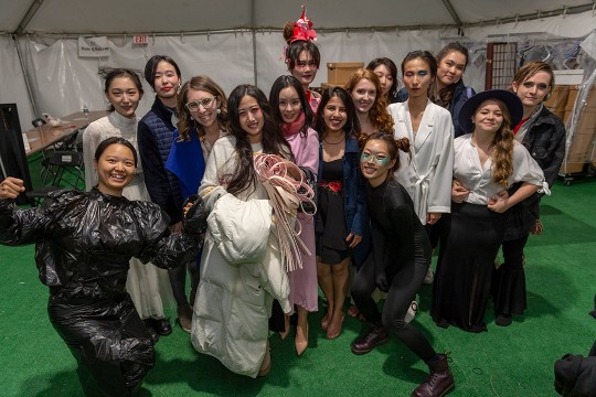 Group of students wearing fashion creations.