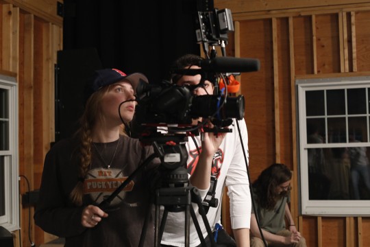 Gayle McAdams operates a camera in the soundstage.