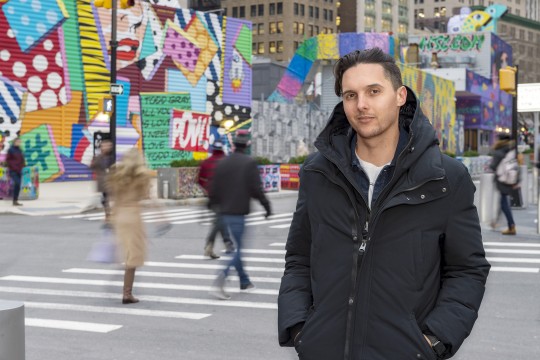 John Traver poses for a portrait outside in New York City.