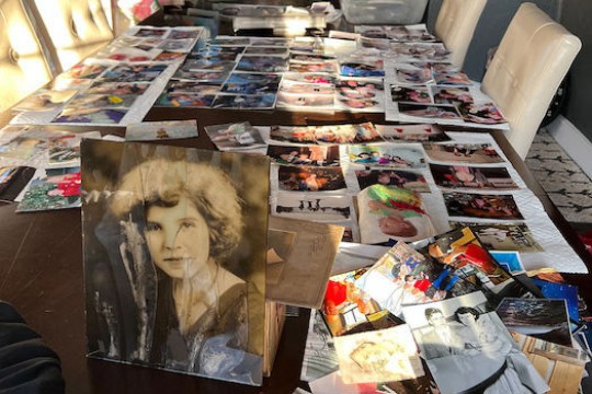 Table with multiple pictures over it.