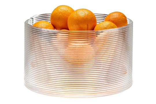 a 3d printed glass bowl is filled with oranges.
