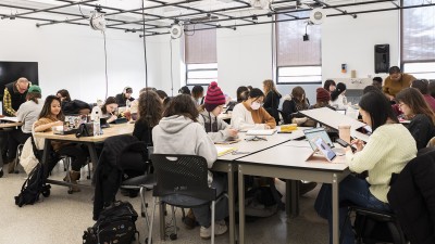 A wide view of students working in an illustration studio.
