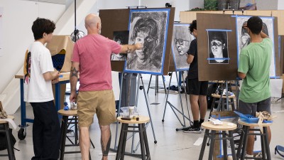 Faculty Denton Crawford teaches drawing to students.