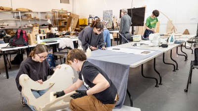 Students work in an industrial design studio.