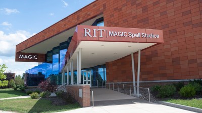exterior of the R I T magic spell studios building, featuring a large, covered ramp up to the front doors.