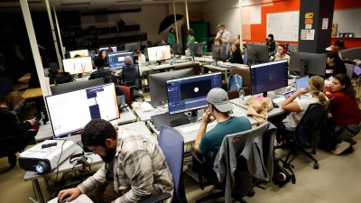 Students work on computers in a lab.