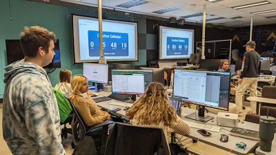 students work in a computer lab.