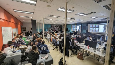 A group of students in the new media design lab, working. 