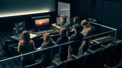 RIT faculty Don Casper instructs students in MAGIC Spell Studios' color correction suite.