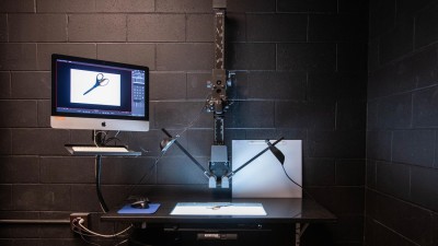 Stop motion set in a black room with 2 bright lights shining on a white canvas