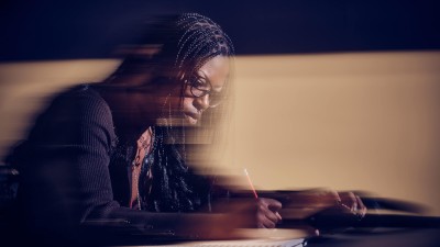 blurry view suggesting motion of a student drawing.