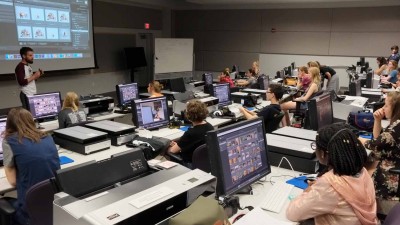 Large lecture hall with computers and printers at each station