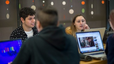 Students work on their laptops.
