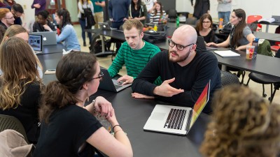 Students receive portfolio reviews from alumni.