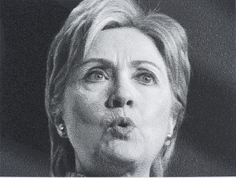 Black and white photograph of Hillary Clinton, former U.S Secretary of State, she appears to be mid-speech, with her lips pursed.