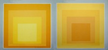 A large scale mural featuring four gradient yellow squares set within each other. The piece on the left; going from dark shade yellow on the outermost square to a lighter shade on the innermost square. The piece on the right; going from a light shade of yellow on the outermost square to a darker shade on the innermost square.
