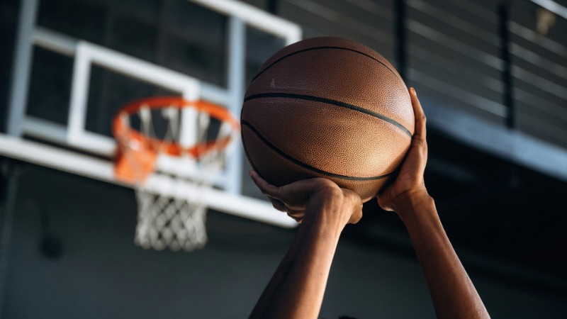 Someone shooting a basketball