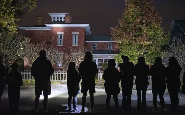 Big Shot volunteers light the Susan B. Anthony Museum.