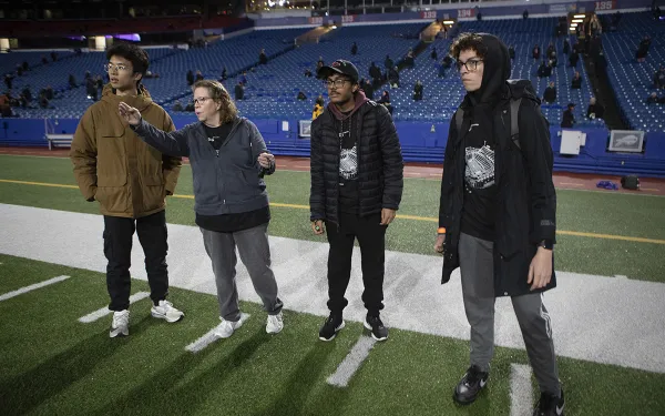 Nanette Salvaggio gives marching orders on the field prior to the Big Shot.