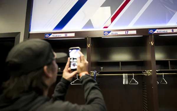 A student takes a picture of Josh Allen's locker.  Photo by Rebecca Villagracia