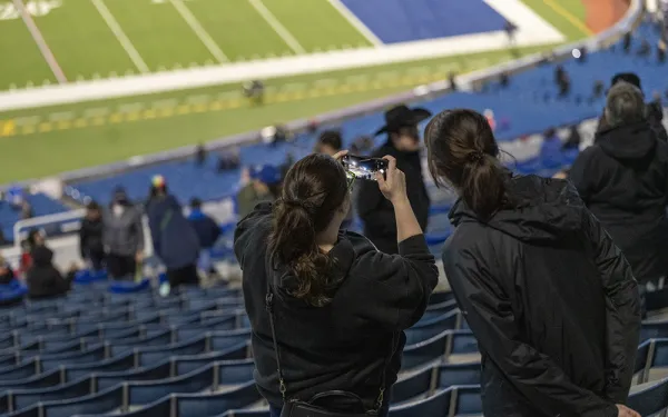 Big Shot participants take a photo with their phone.