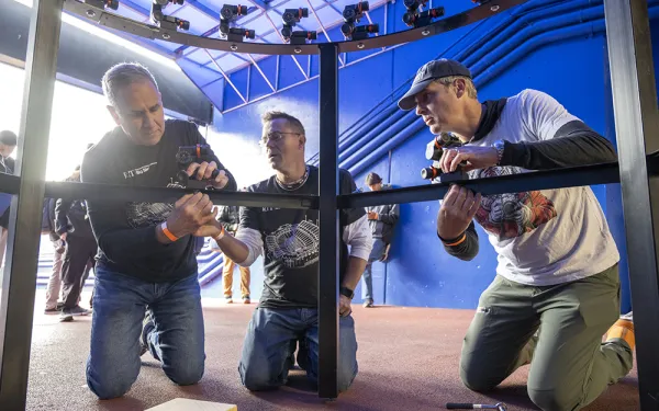 Kevin Lamark, Eric Kunsman, and Todd Jokl prepare the 360-degree camera rig.