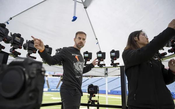 Dan Hughes works with a student to assemble the 360 rig.