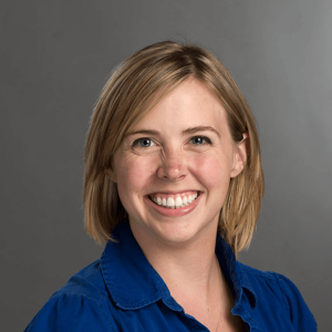 Professional shot of Hillary McCormick against a gray background.