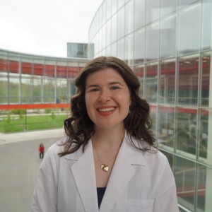 student headshot in front of glass pane