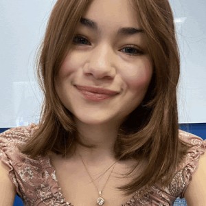 Student smiling at camera