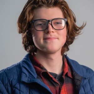 Nolan Kearny's headshot on a gray background