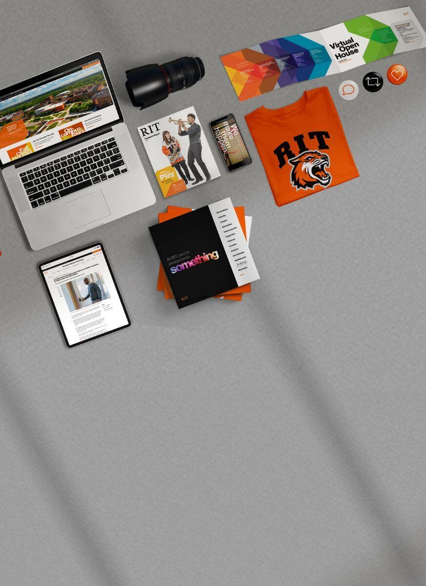 R I T branded items including a laptop, shirt, magazine, tablet, and notebook.