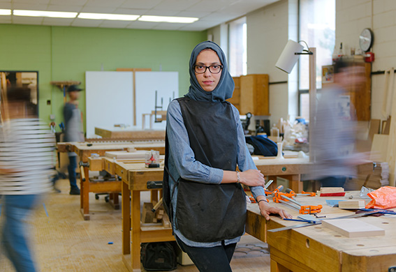 Moving background with a woman in a woodworking shop