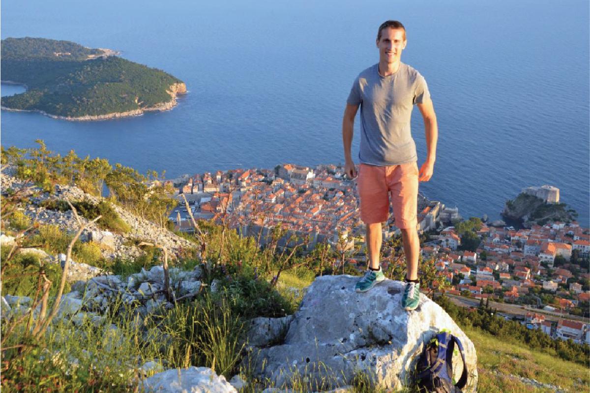 student overlooking a view abroad