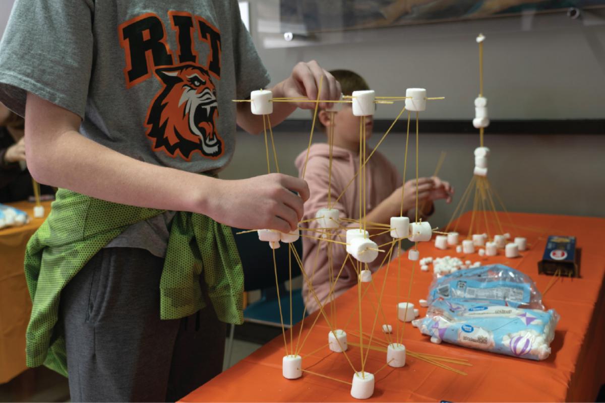 students making structural towers with sticks and marshmallows