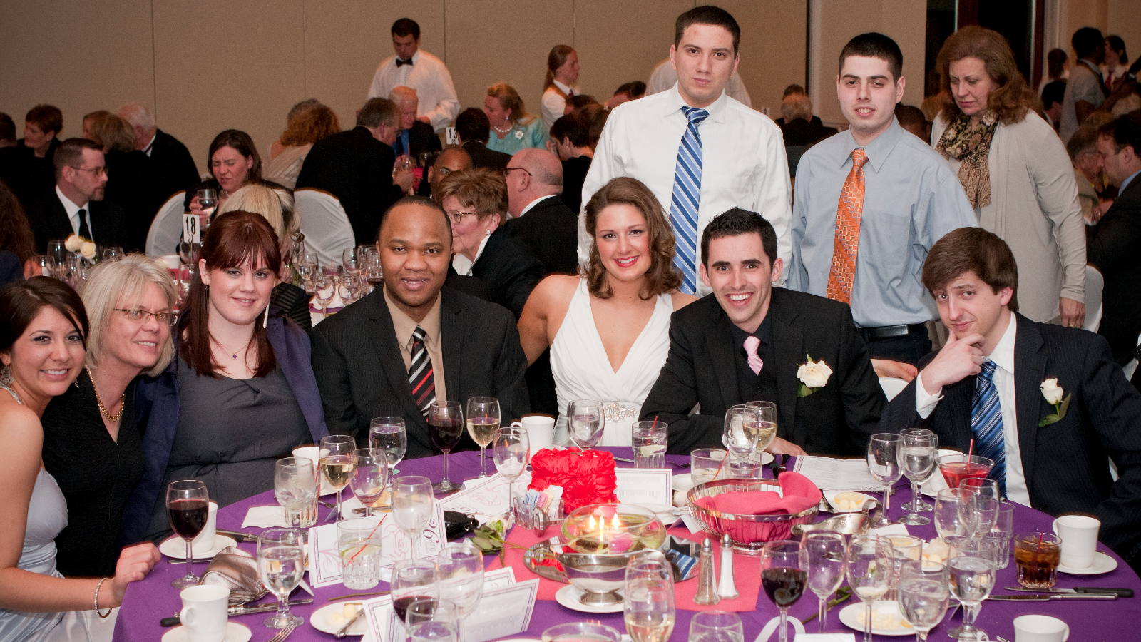 Group posing for a photo during dinner