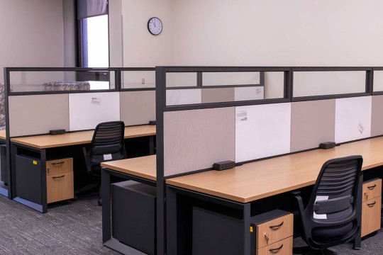 meeting space with several workstations.