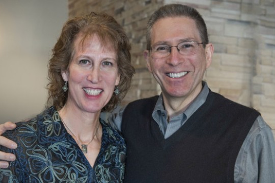 Two people posing for camera