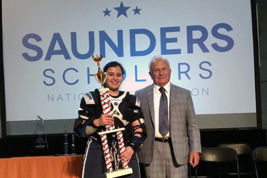 Gabby Garcia and E. Philip Saunders pose for a photo together with trophy.