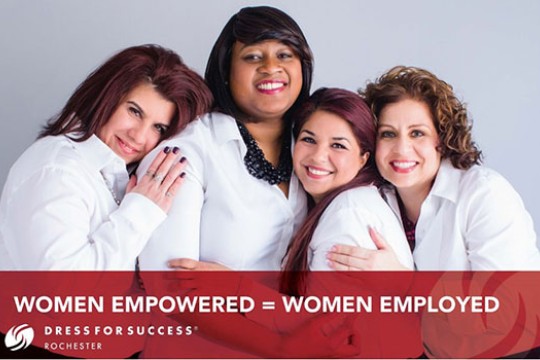 Four women wearing white shirts pose for a photo. Text at the bottom saying "women empowered equal women employed".