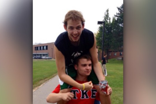 Person sitting on someone's shoulder