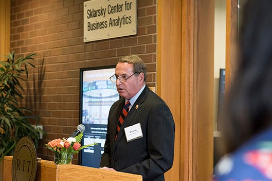 Man speaking at a podium.