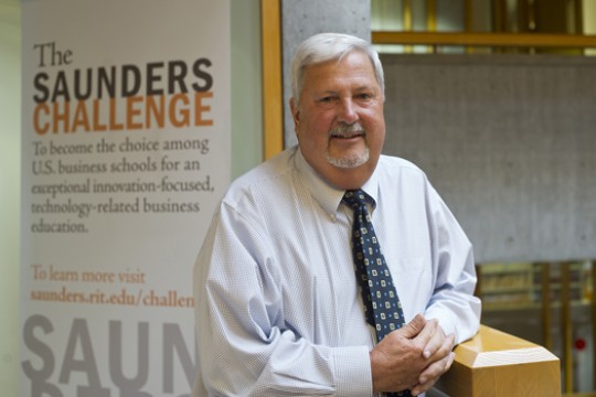 Professor posing for camera in building