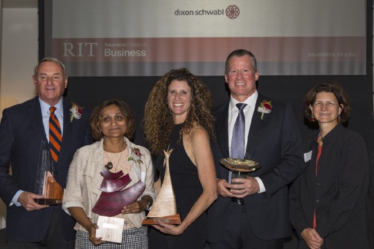 Frank Sklarsky, Dr. Shal Khazanchi, Carin DeMilo, and Scott Ingwers pose with their Recommence awards alongside Dean Jacqueline Mozrall.