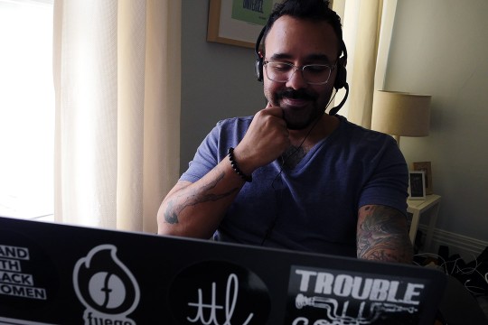 professor looking at laptop.