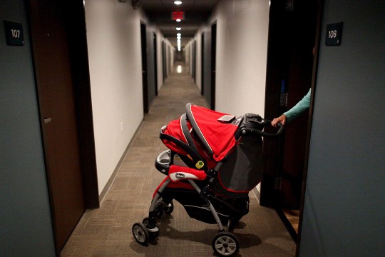 baby stroller in a hotel hallway.