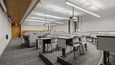 a lecture hall with raised, semi circle seating.