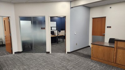 a reception area with access to a small meeting room.
