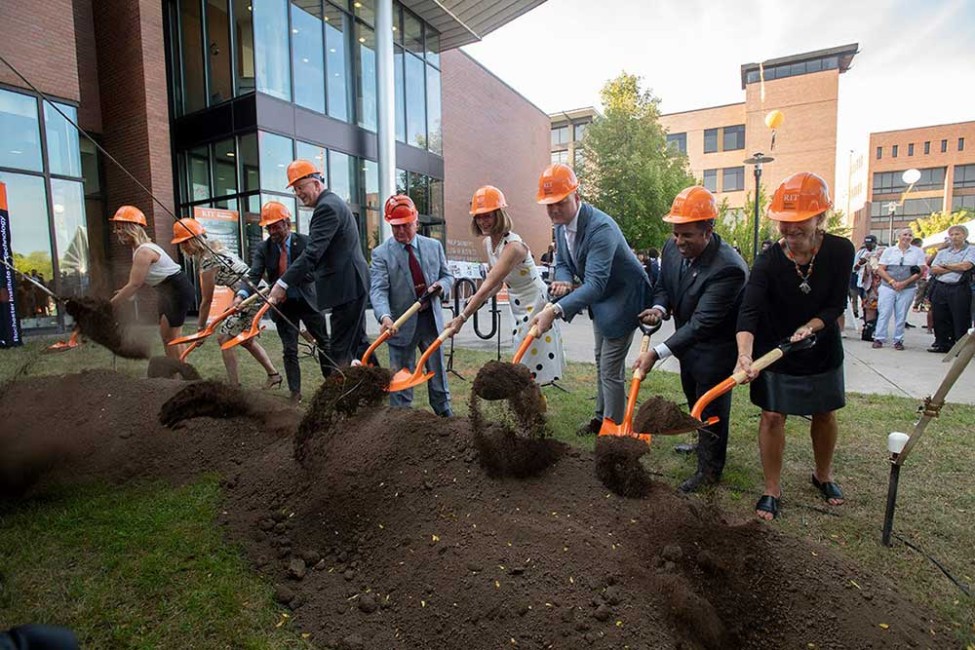 Phil Saunders and others breaking ground on the College of Business expansion